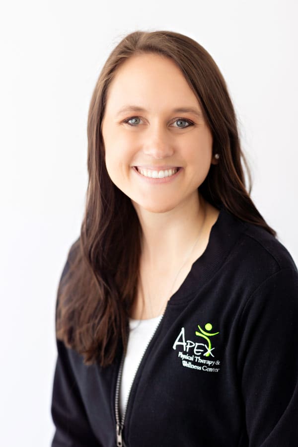 A professional headshot of Rachel Failing, a smiling woman with long hair wearing a black jacket with an 